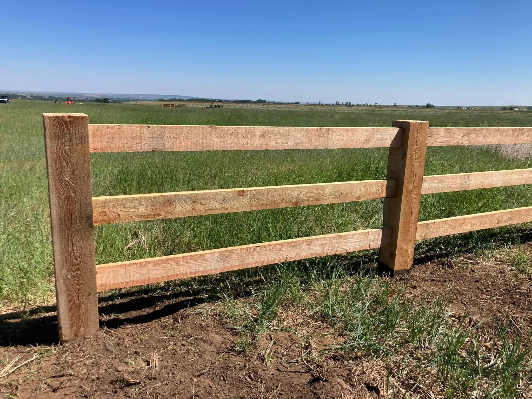 Wood post and rail fence installation, Beartooth region Montana